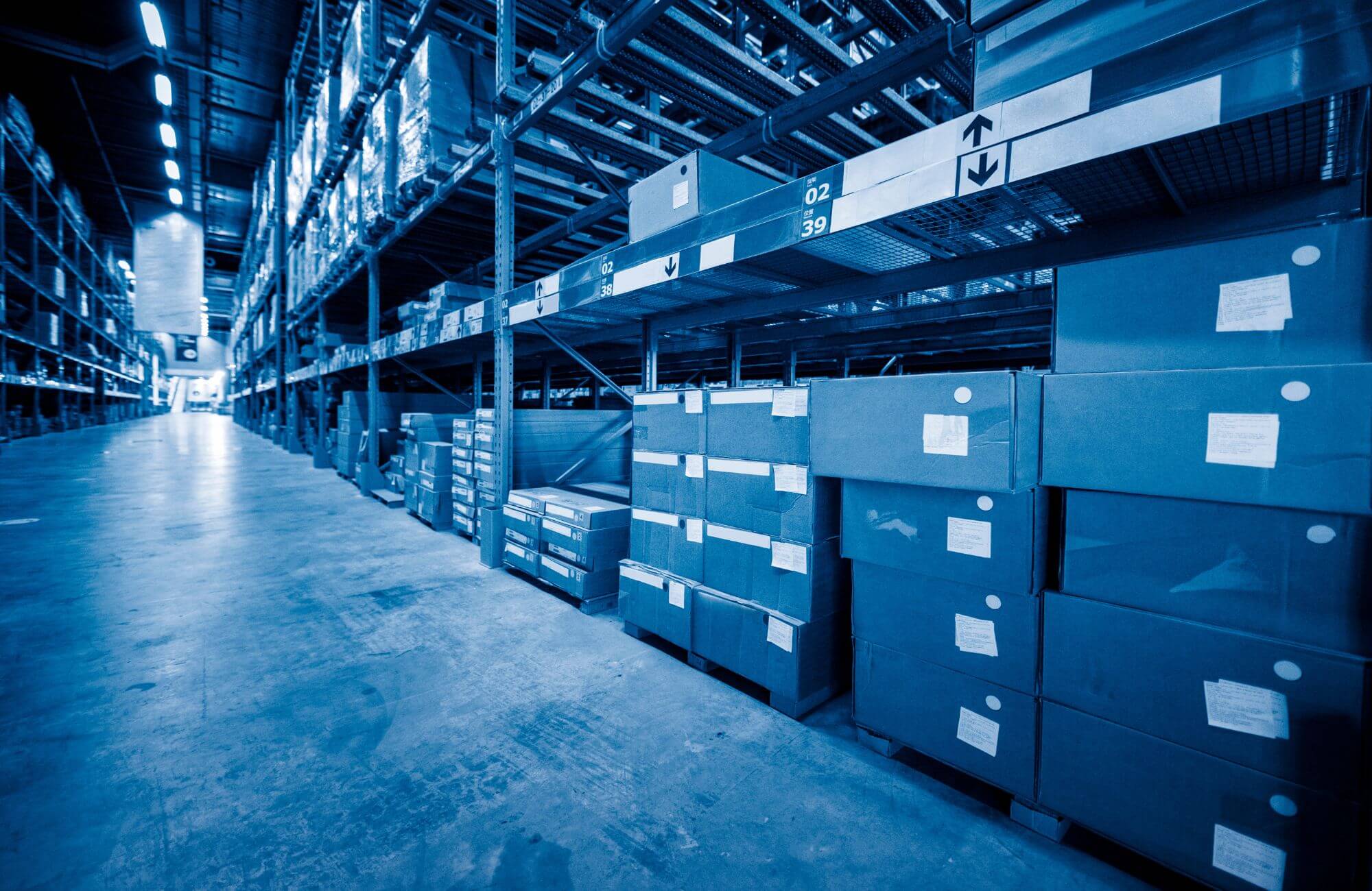 A warehouse filled with lots of boxes and shelves.