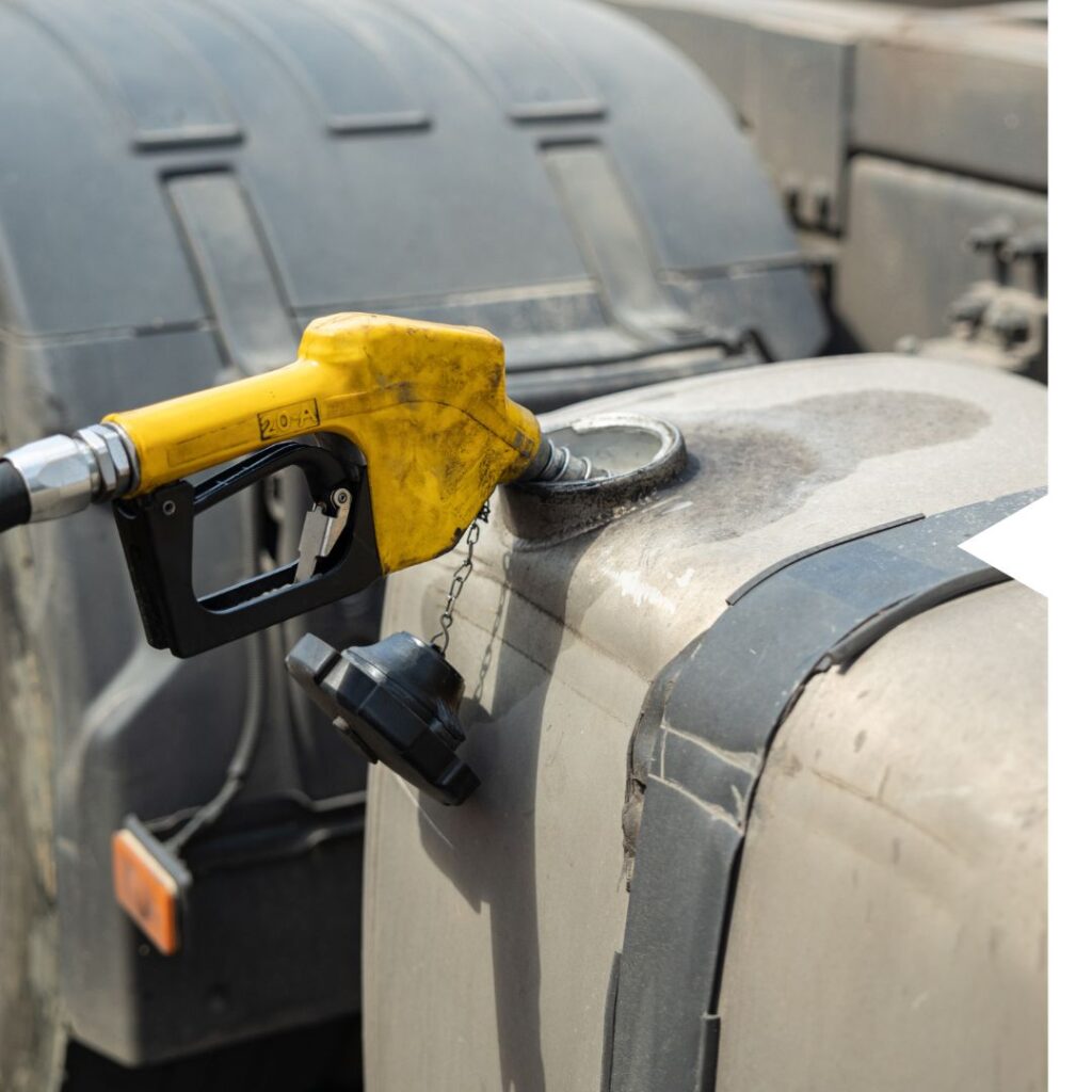 A gas pump is attached to the side of a tanker truck.